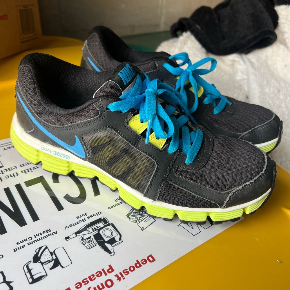 Nike woman’s  Black and Blue Running Shoes